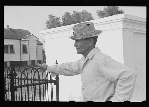 Untitled photo, possibly related to: Tomb painter in cemetery at Pointe a la Hache, Louisiana