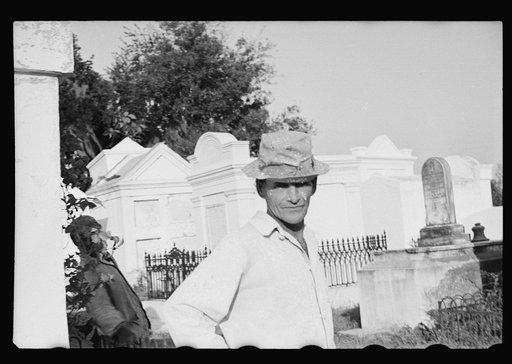 Tomb painter in cemetery at Pointe a la Hache, Louisiana