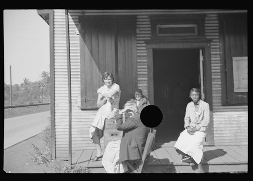 Untitled photo, possibly related to: The Shack, a one time church; milk is dispensed here. Relief clients wait for hours, Scotts Run, West Virginia