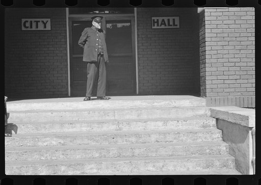 Old fireman in front of city hall, Maynardville, Tennessee