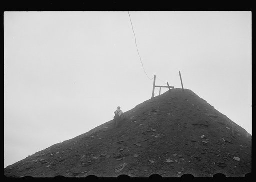Untitled photo, possibly related to: Man salvaging coal; they receive ten cents per hundred pound sack or two dollars a ton, one man can make from ten to twenty sacks a day, Nanty Glo, Pennsylvania