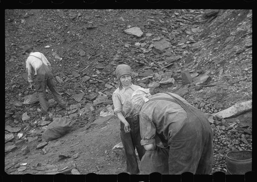 Untitled photo, possibly related to: Woman and child picking coal from a slag heap. They are paid ten cents for each 100 pound sack, Nanty Glo, Pennsylvania