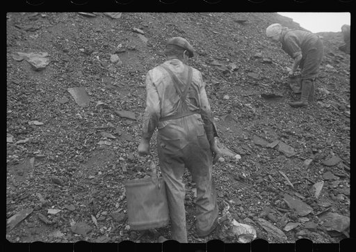 Untitled photo, possibly related to: Woman and child picking coal from a slag heap. They are paid ten cents for each 100 pound sack, Nanty Glo, Pennsylvania