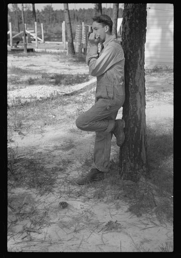 Untitled photo, possibly related to: Boy playing mouth organ, Penderlea Homesteads, North Carolina