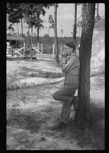 Boy playing mouth organ, Penderlea Homesteads, North Carolina