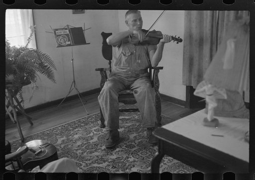 Untitled photo, possibly related to: One of the Westmoreland homesteaders playing his violin, Pennsylvania