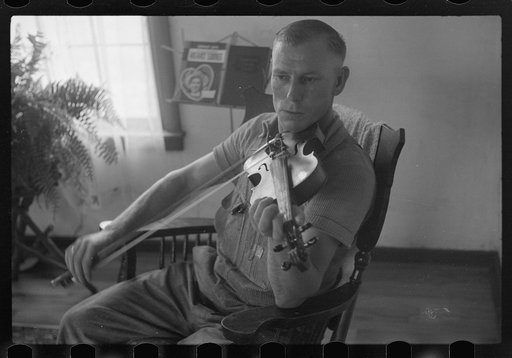 Untitled photo, possibly related to: One of the Westmoreland homesteaders playing his violin, Pennsylvania