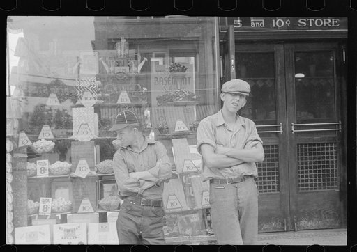 Two boys standing in front of candy store window, street scene, Circleville, Ohio (see general caption)