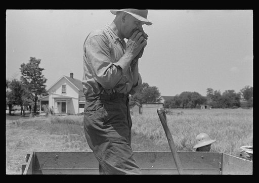 Member of threshing crew, central Ohio