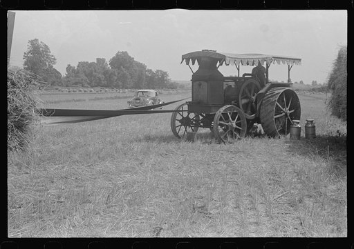 Gasoline tractor furnishing power for threshing, central Ohio