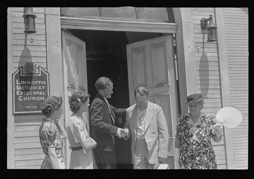 Pastor greeting his parishioners, Linworth, Ohio