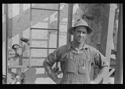 Harvest hand and helper on the Virgil Thaxton farm near Mechanicsburg, Ohio