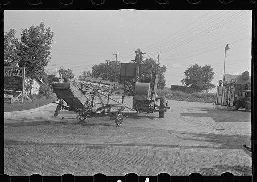 Untitled photo, possibly related to: Moving combine and tractor, central Ohio (see general caption)