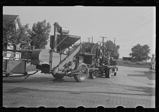 Untitled photo, possibly related to: Moving combine and tractor, central Ohio (see general caption)