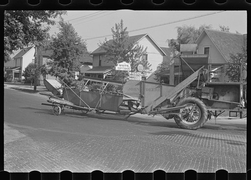 Untitled photo, possibly related to: Moving combine and tractor, central Ohio (see general caption)