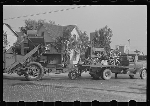 Untitled photo, possibly related to: Moving combine and tractor, central Ohio (see general caption)