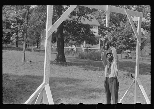 Accokeek, Maryland. A modern version of an old medieval jousting tournament game: picking off a ring on a lance while riding by on horseback at full speed.
