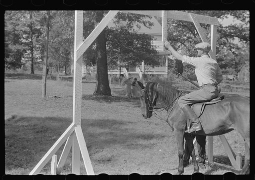 Accokeek, Maryland. A modern version of an old medieval jousting tournament game: adjusting a ring to be picked off.