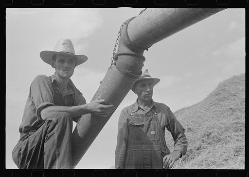 Untitled photo, possibly related to: Two members of threshing crew, central Ohio (see general caption)