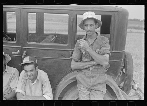 Harvest hand and helper on the Virgil Thaxton farm near Mechanicsburg, Ohio