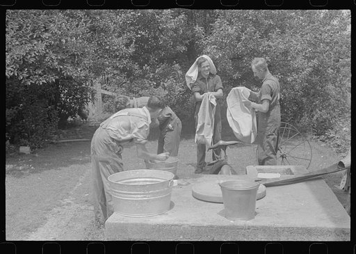 Washing up before dinner during wheat harvest, central Ohio