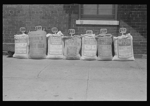 Stock feed in front of feed store, Route 40, central Ohio