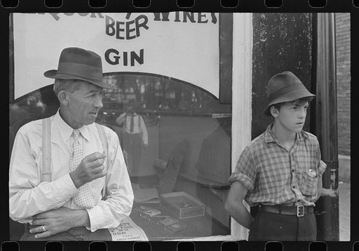 Untitled photo, possibly related to: Boy in front of liquor store, Newark, Ohio