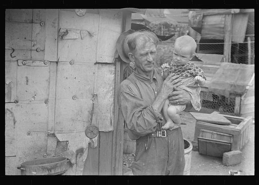 Ex-farmer and child, now on W.P.A. (Work Projects Administration), central Ohio