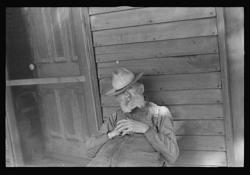 Circleville, Ohio's "Hooverville" (see general caption). Begins to talk: "No man in the United States had the trouble I had since 1931. No man. Don't talk to me. I'm deaf. I lost my farm in 1931. I went to work in an acid factory. I got acid spilt on me; burnt my nose and made me blind. Then I get t