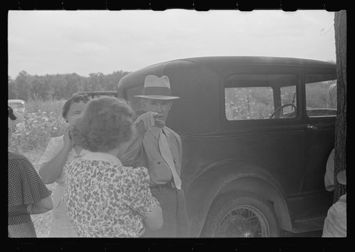 Untitled photo, possibly related to: Farmer's wife watching proceedings at farm auction, New Carlisle [i.e. Marysville], Ohio