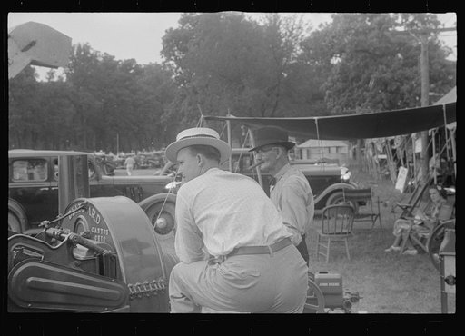 Attendants at farm machinery display at county fair, central Ohio