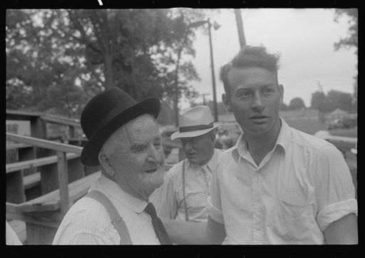 Untitled photo, possibly related to: Attendant at county fair, central Ohio