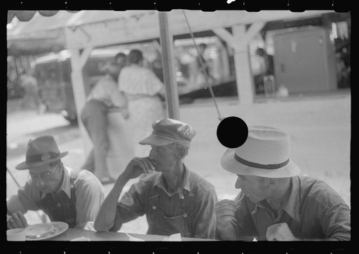 Untitled photo, possibly related to: Spectators at county fair eating lunch, central Ohio
