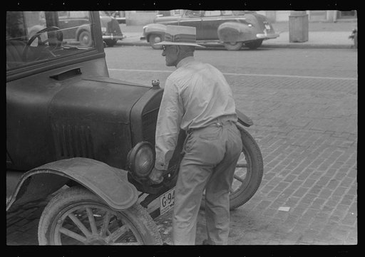 Cranking Model "T" Ford before the days of the self-starter, Worthington, Ohio