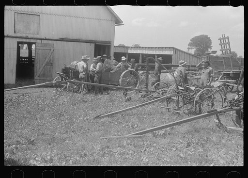 Untitled photo, possibly related to: Inspecting farm machinery at public auction in central Ohio