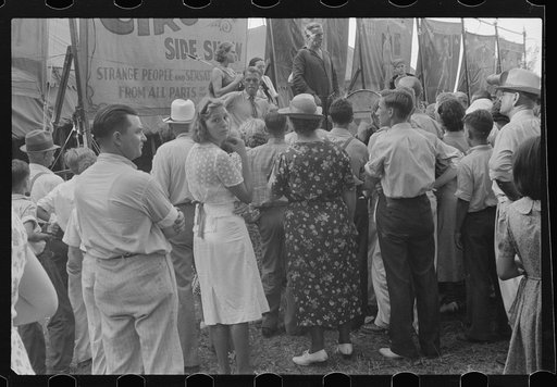 Untitled photo, possibly related to: Spectators at sideshow, county fair, central Ohio
