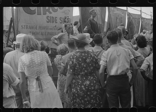 Spectators at sideshow, county fair, central Ohio