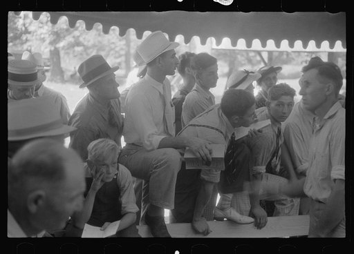 Untitled photo, possibly related to: Spectators at sideshow, county fair, central Ohio