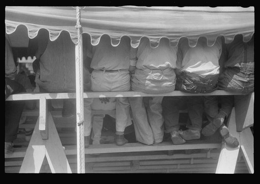 Spectators at sideshow, county fair, central Ohio