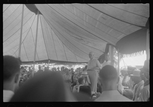 Untitled photo, possibly related to: Spectators at sideshow, county fair, central Ohio