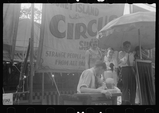 Untitled photo, possibly related to: Selling tickets to the sideshow, county fair, central Ohio