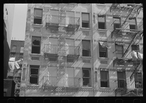 New York, New York. 61st Street between 1st and 3rd Avenues. House fronts