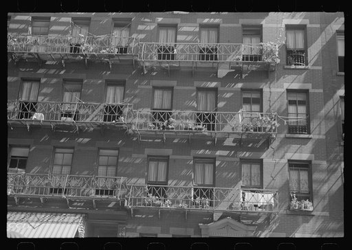New York, New York. 61st Street between 1st and 3rd Avenues. House fronts