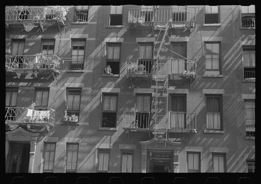 New York, New York. 61st Street between 1st and 3rd Avenues. House fronts