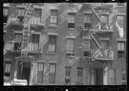 New York, New York. 61st Street between 1st and 3rd Avenues. House fronts