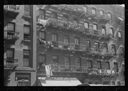 New York, New York. 61st Street between 1st and 3rd Avenues. House fronts