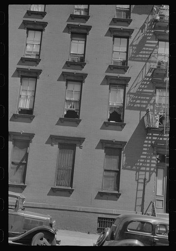 New York, New York. 61st Street between 1st and 3rd Avenues. House fronts