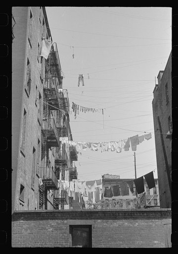 New York, New York. 61st Street between 1st and 3rd Avenues. Apartment houses from the rear