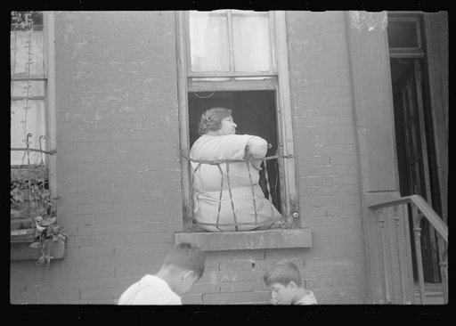 Untitled photo, possibly related to: New York, New York. 61st Street between 1st and 3rd Avenues. Children playing in the street