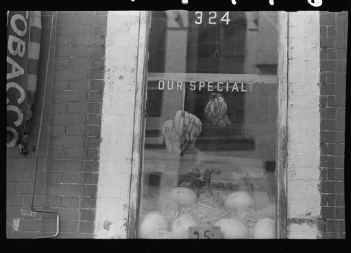 New York, New York. 61st Street between 1st and 3rd Avenues. A shop window